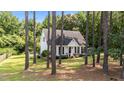 Beautiful single-story home with a manicured lawn surrounded by mature trees at 918 Circle Dr, Angier, NC 27501