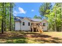 Backyard of the house showing the back porch and stairs at 121 Quarterhorse Dr, Louisburg, NC 27549