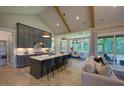 This stunning kitchen has a spacious island with seating and modern appliances that are ready for use at 16 Calming Pl Pl, Fuquay Varina, NC 27526