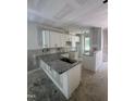 New kitchen featuring granite countertops, white cabinets, and stainless steel sink at 207 S Main St # A, Four Oaks, NC 27524