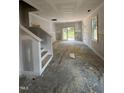 Spacious new living room with rear patio access; ready for your personal touch at 207 S Main St # A, Four Oaks, NC 27524