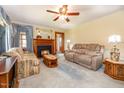 Inviting living room with a cozy fireplace, comfortable seating, and plenty of natural light at 2129 Wrenn St, Burlington, NC 27215
