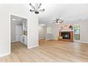 Open living area showcasing hardwood floors, fireplace, and easy access to the kitchen and dining areas at 232 Clancy Cir, Cary, NC 27511