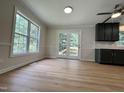 Open floor plan showcasing updated kitchen cabinets, countertops, and stainless ceiling fan at 3212 Potthast Ct, Raleigh, NC 27529