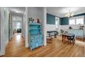Dining room showcasing hardwood floors, decorative hutch, and ample natural light at 322 Tobacco Farm Way, Chapel Hill, NC 27516