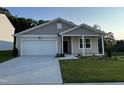 Charming single-Gathering home with a two-car garage and well-manicured lawn at 3428 Pinnacle Peak Dr, Raleigh, NC 27604