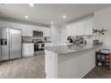 Bright kitchen with stainless steel appliances, granite countertops, and white cabinets at 3641 Drafton Dr, Raleigh, NC 27610