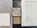 A selection of interior materials, including Crema Caramel granite, carpet and white trim at 367 Deodora Lane Ln, Cameron, NC 28326