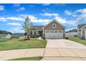 Inviting home with a well-kept lawn, two-car garage, and a cozy front entrance at 48 Highview Ct, Fuquay Varina, NC 27526