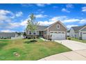 Beautiful home with a manicured lawn, two-car garage, and a scenic neighborhood view at 48 Highview Ct, Fuquay Varina, NC 27526