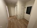 Entryway featuring hardwood floors, neutral paint, and a front door with glass detail at 7194 Johns Point Ct, Liberty, NC 27298