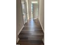 Welcoming entryway featuring luxury vinyl plank flooring and white doors at 0416 Hazy Hls Ln, Garner, NC 27529