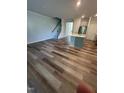 Spacious living room featuring an open floor plan and stairs to second level at 0416 Hazy Hls Ln, Garner, NC 27529