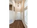 Bright foyer features hardwood floors, soaring ceilings and large windows at 108 Bally Shannon Way, Apex, NC 27539