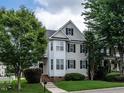 Charming two-story home with a manicured lawn and a classic architectural style at 108 Bally Shannon Way, Apex, NC 27539