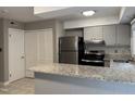 Open kitchen featuring granite countertops, stainless steel appliances, and tile backsplash at 1136 Nottingham Cir, Cary, NC 27511