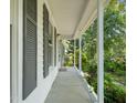 The covered front porch offers a welcoming entrance with plenty of space for outdoor seating at 1317 Elmset Ln, Durham, NC 27713