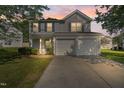 Inviting two-story home showcasing great curb appeal and a convenient two-car garage at 211 Cloverdale Dr, Durham, NC 27703