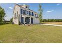 Beautiful new construction featuring a large front yard and charming curb appeal at 227 Faith Avenue, Sanford, NC 27330
