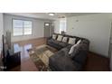 Spacious living room featuring hard wood floors and a comfortable sectional sofa at 2907 S S Roxboro St, Durham, NC 27707