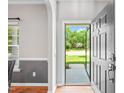 Welcoming entryway with hardwood floors, light-gray walls, and natural light pouring in from the front at 3201 Sawyers Mill Dr, Apex, NC 27539