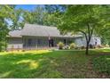 Charming one-story home with a welcoming front porch and well-manicured lawn at 4070 Swannie Coble Rd, Snow Camp, NC 27349
