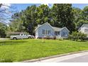 Beautiful home with lush lawn and mature trees in a quiet residential neighborhood at 5105 Baywood Forest Dr, Knightdale, NC 27545