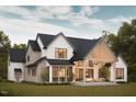 Expansive backyard with a covered patio and outdoor seating area, perfect for entertaining and relaxation at 8016 Penny Rd, Raleigh, NC 27606