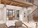 Inviting foyer with high ceilings, wood accents, and a staircase with iron railings, offering a grand entrance at 8016 Penny Rd, Raleigh, NC 27606