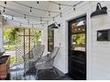 Inviting front porch with seating and decorative string lights at 1103 S Bloodworth St, Raleigh, NC 27601