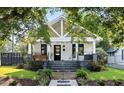 Charming home with manicured lawn, walkway, and inviting front porch at 1103 S Bloodworth St, Raleigh, NC 27601