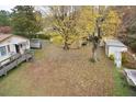 Aerial view of the expansive backyard featuring a mix of open space and mature trees at 124 Jack Bennett Rd, Chapel Hill, NC 27517