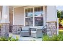Inviting front porch with stone accents and comfortable seating at 1880 Woodall Crest Dr, Apex, NC 27502