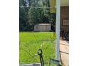 View of spacious backyard with shed, providing ample storage and potential for outdoor activities at 2306 Cool Springs Rd, Sanford, NC 27330