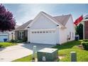 An eye-level view of the home's roof and a portion of the driveway at 326 Slate Dr, Gibsonville, NC 27249