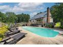 Backyard with a swimming pool, a deck, outdoor seating and lounge chairs at 3573 Northern Estates Cir, Rocky Mount, NC 27804