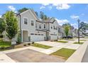 Modern townhomes line a well-maintained street in a desirable neighborhood at 479 Clark Creek Ln, Cary, NC 27519