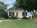 Inviting single-story home with a classic design, complemented by neatly trimmed bushes, and healthy green grass at 526 Cardena School Rd, Fuquay Varina, NC 27526