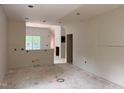 Spacious unfinished open floor plan with visible wiring, ready to be customized to your style at 701 East St, Smithfield, NC 27577