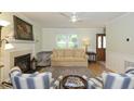 Inviting living room showcases a fireplace, comfortable seating, natural light, and wood flooring at 711 W Carver St, Durham, NC 27704