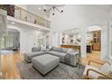 Spacious living room with high ceilings, clerestory windows, and an open floor plan at 7529 Tynewind Dr, Wake Forest, NC 27587