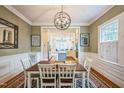 Cozy dining room with view into the bright, updated kitchen at 1213 Pierce St, Raleigh, NC 27605