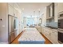 Bright, updated kitchen with stainless steel appliances and granite countertops at 1213 Pierce St, Raleigh, NC 27605