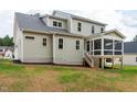 Rear view of the house showing the screened porch and light green siding at 150 Purslane Dr, Franklinton, NC 27525