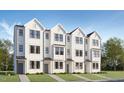 Charming townhomes with black framed windows and modern white exteriors at 1531 Crescent Townes Way, Raleigh, NC 27604