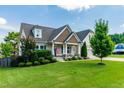 Charming single Gathering home with well-manicured lawn and mature trees on a sunny day at 20 Kola Nut, Smithfield, NC 27577