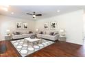 Elegant living room featuring hardwood floors, neutral walls, and classic furnishings for a comfortable space at 212 Mickleson Ridge Dr, Raleigh, NC 27603