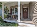 Inviting front porch with rocking chairs, perfect for relaxing and enjoying the outdoors at 213 N Weststone Blvd, Fuquay Varina, NC 27526