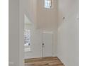 Welcoming foyer with soaring ceilings, modern lighting, and hardwood floors at 239 Faith Avenue, Sanford, NC 27330