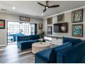 Stylish living room with modern furniture, unique artwork, and a ceiling fan at 3441 Jordan Shires Dr, New Hill, NC 27562